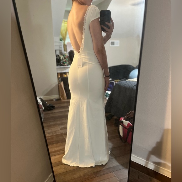 Lulu’s Love Will Follow White Cap Sleeve Mermaid
Maxi Dress - Picture 6 of 6